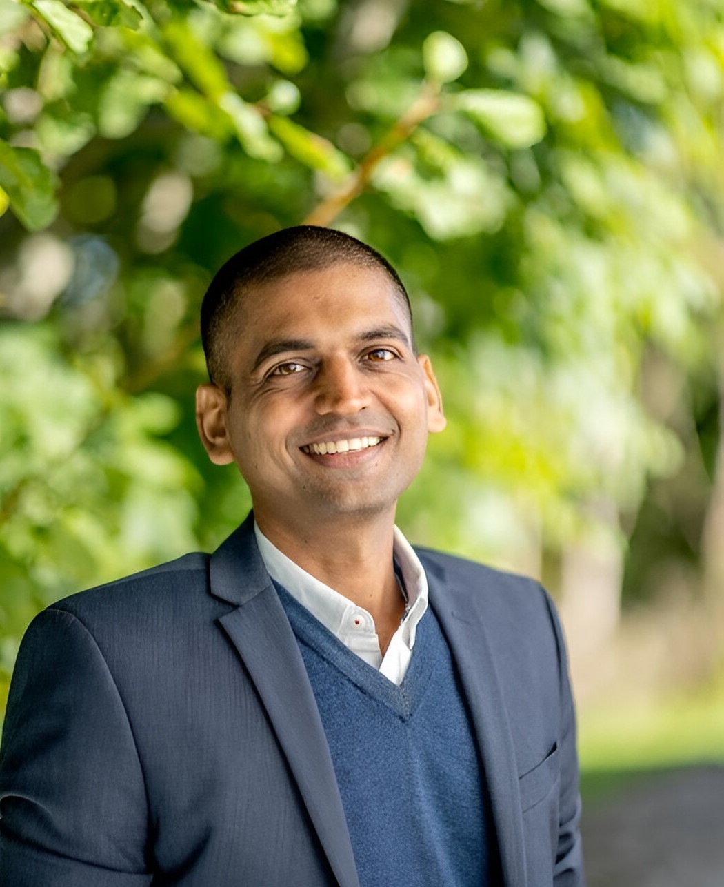 Kapil Goyal smiling in a park